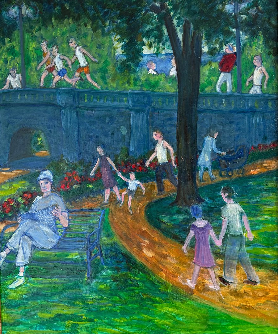 Englischer Garten Artie standing beside Patty, sitting in a chair and smiling