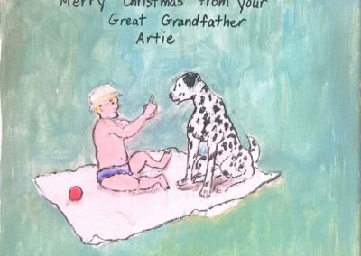 A young boy on a blanket with a Dalmatian